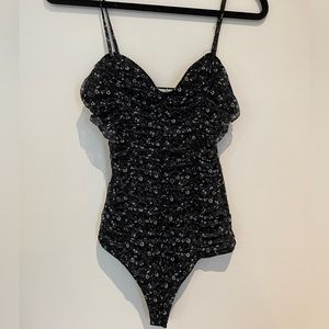 Floral bodysuit from a store called Once Upon a Skirt